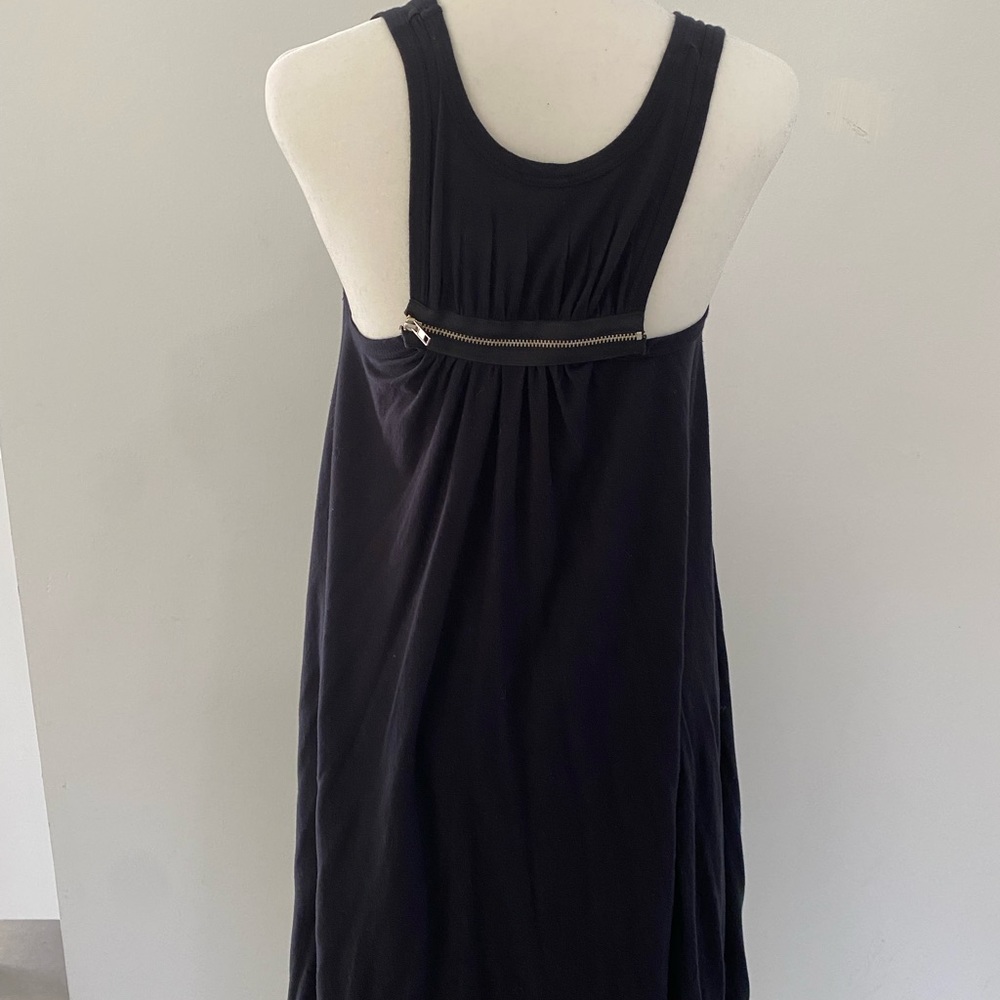 Little black cotton dress. Knee length and the sides are longer.